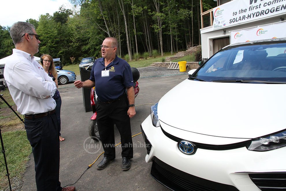 Mike Strizki speaks to a Representative from Toyota Motors about the Mirai Hydrogen powered car