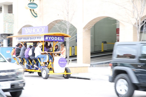SXSW-2014, One of countless Weird sights to be behold in Austin; a mobile bar sponsored by Yahoo! that apparently serves beer to the customers that power this vehicle by pedaling it down the road, steered (of course) by a non-imbibing driver.